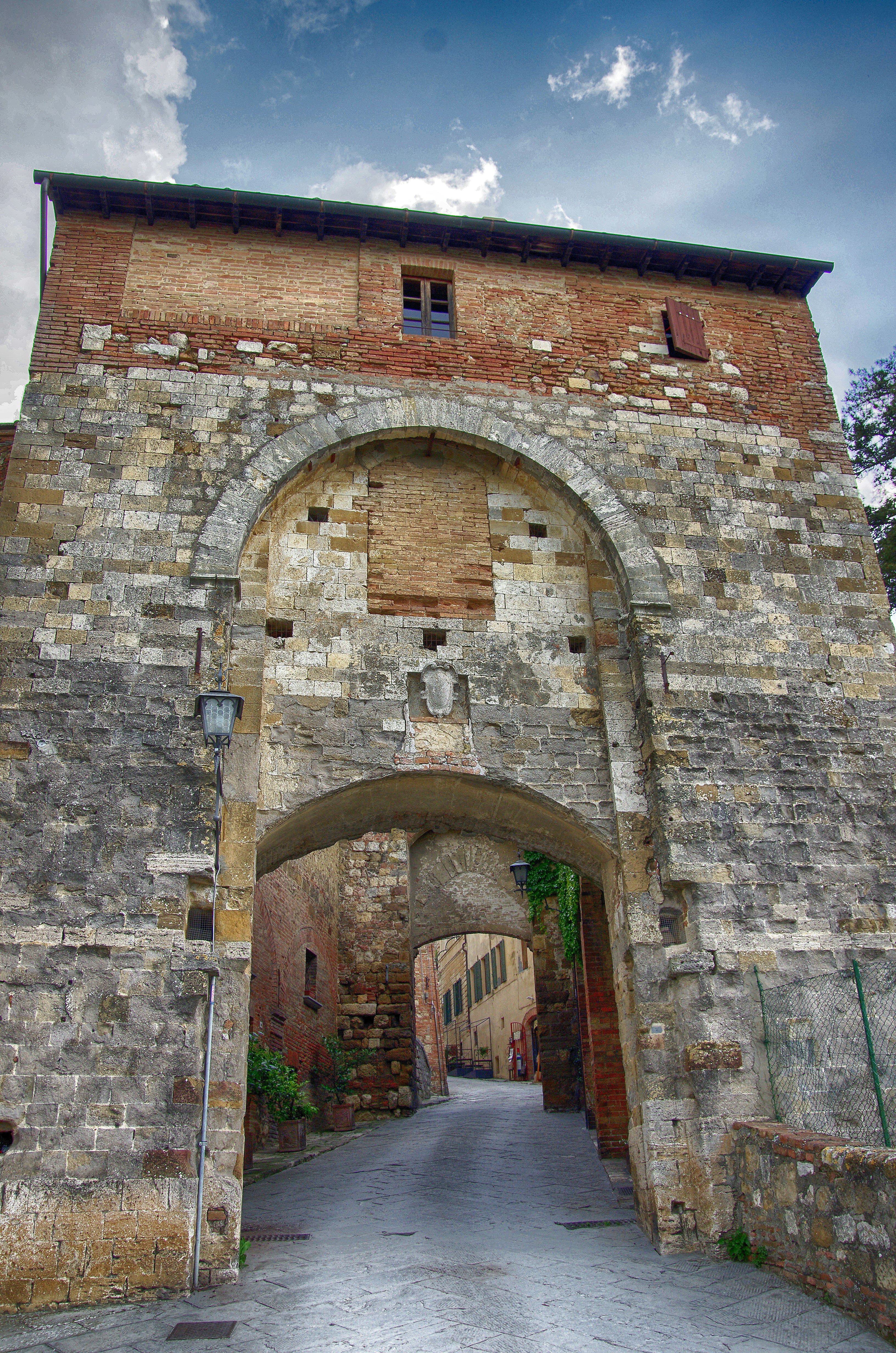 an old brick building with an arched doorway